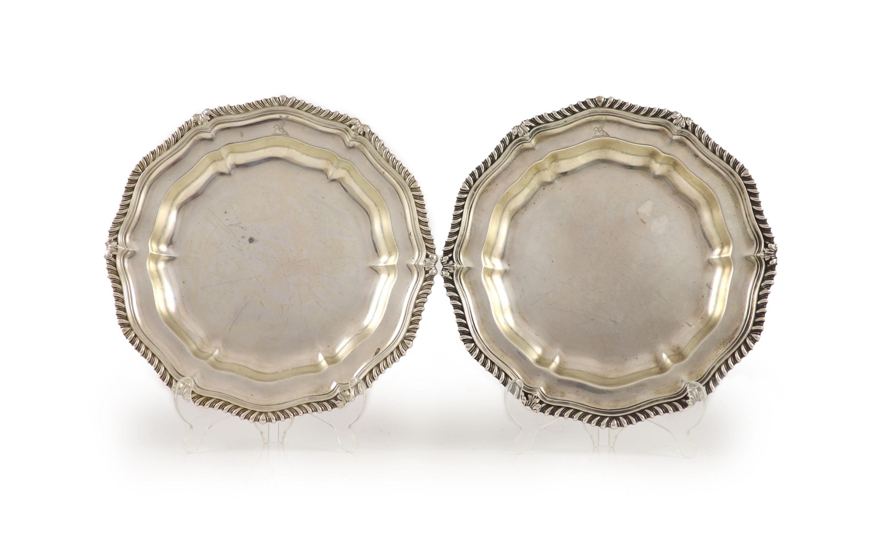 A pair of late George IV silver shaped circular dinner plates by Paul Storr